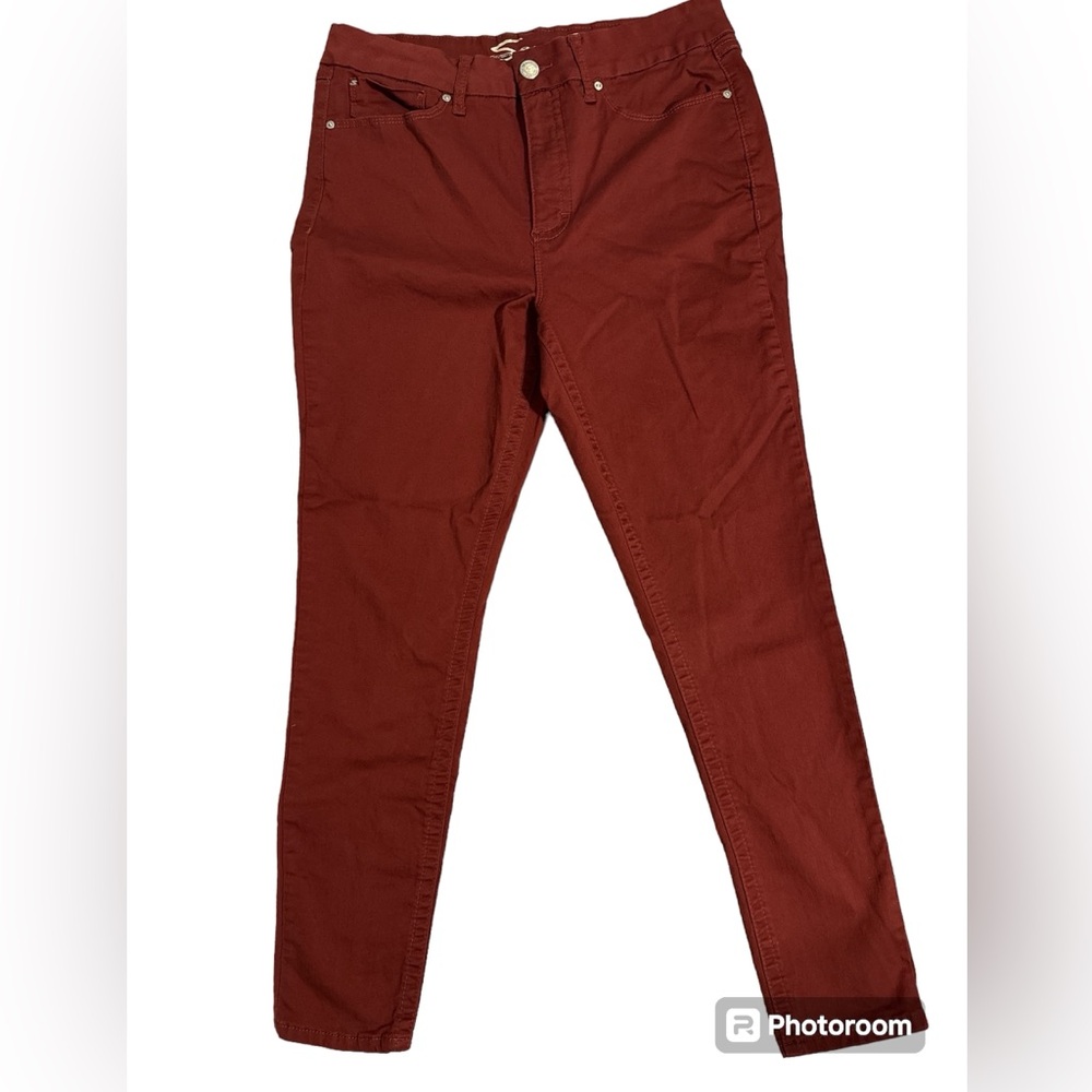 Seven tummyless high rise skinny jeans, knees have the open slit look.